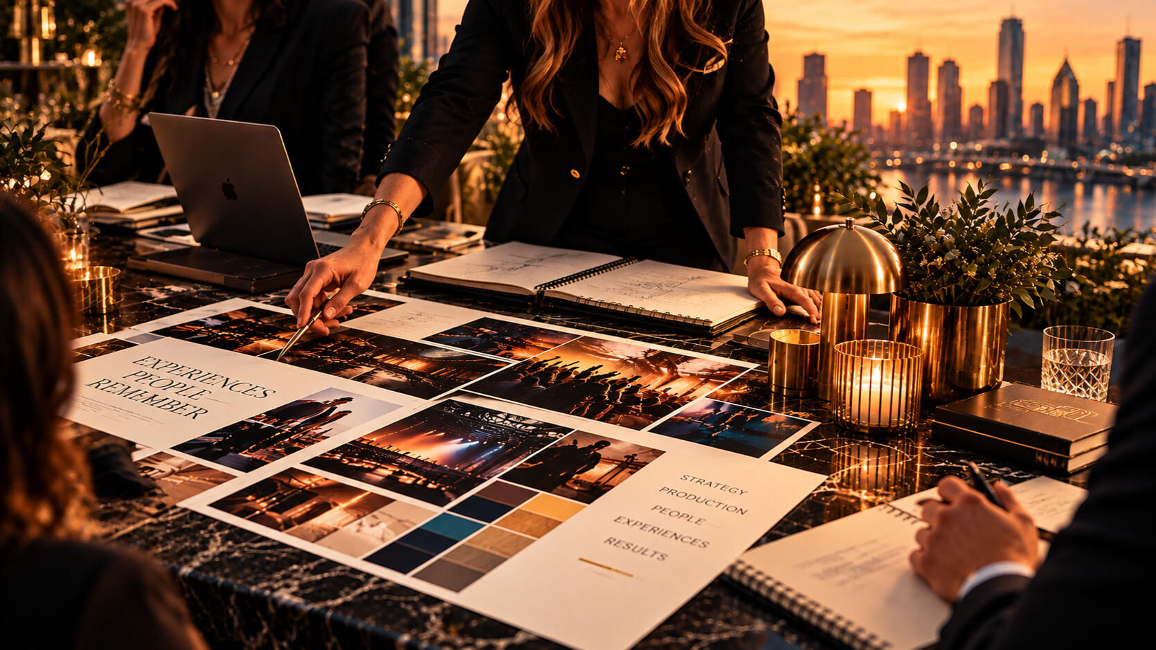 Fractional Event Marketing | Strategic Program Leadership Event planning team reviewing photographs, creative concepts, and production materials around a conference table.